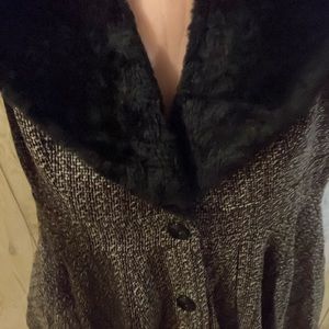 Fully lined fur neckline trimmed dress.